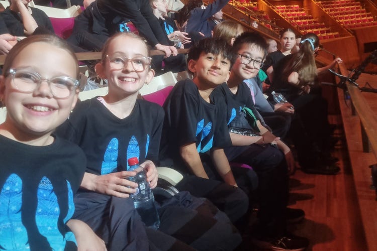 Students sitting in seats together at the Opera House