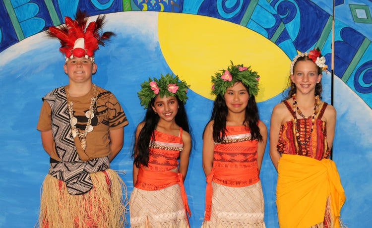A photo of students dressed up in costumes ready for their Moana performance at the school musical.