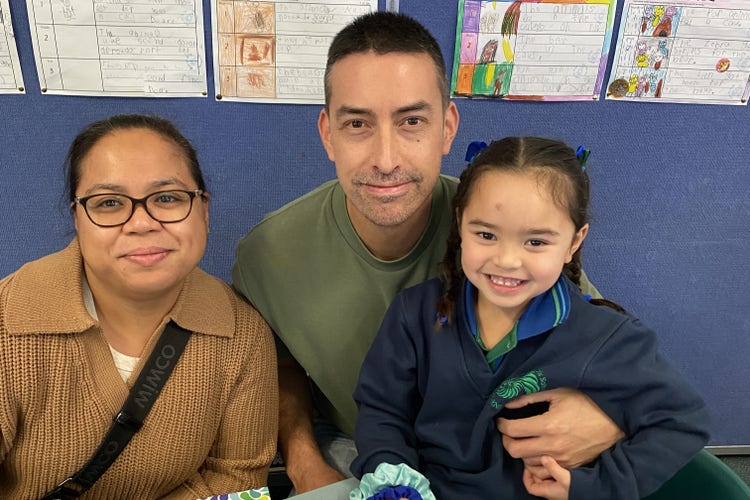 Mum, dad and school student posing for a photo